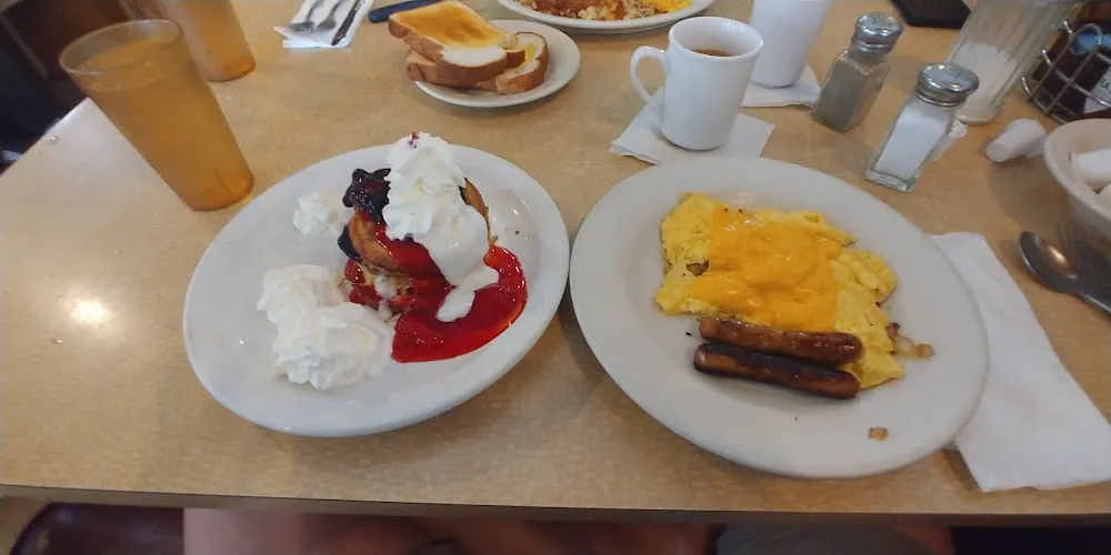 Cinnamon French Toast with Berries Scrambled Eggs with Cheese and Onions and Sausages